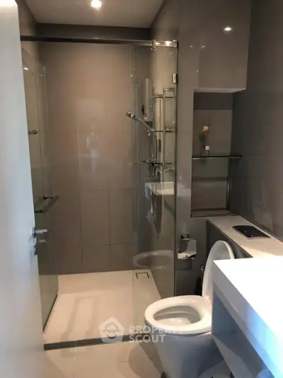 Modern bathroom with glass shower and sleek fixtures