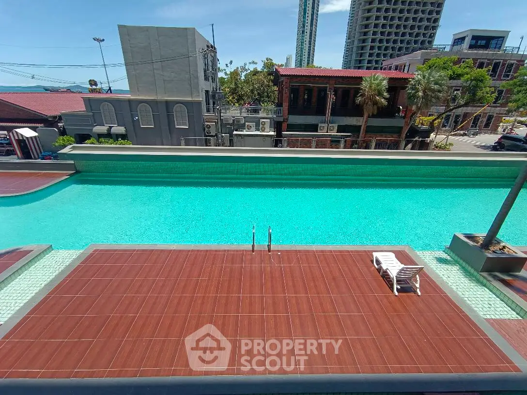 Luxurious rooftop pool with stunning city views and modern deck area.