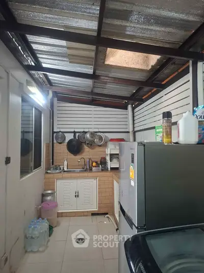 Cozy kitchen with modern appliances and open layout, perfect for culinary enthusiasts.