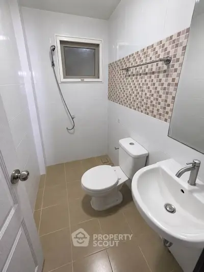 Modern bathroom with sleek fixtures and stylish tile accents