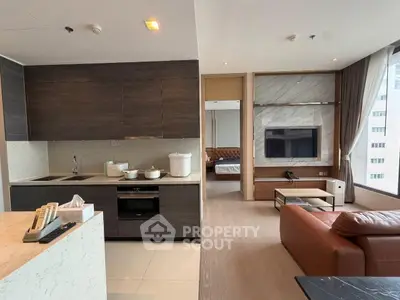 Modern open-layout kitchen and living room with sleek design and city view.