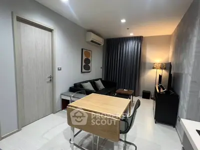 Modern living room with sleek furniture and ambient lighting, perfect for cozy evenings.