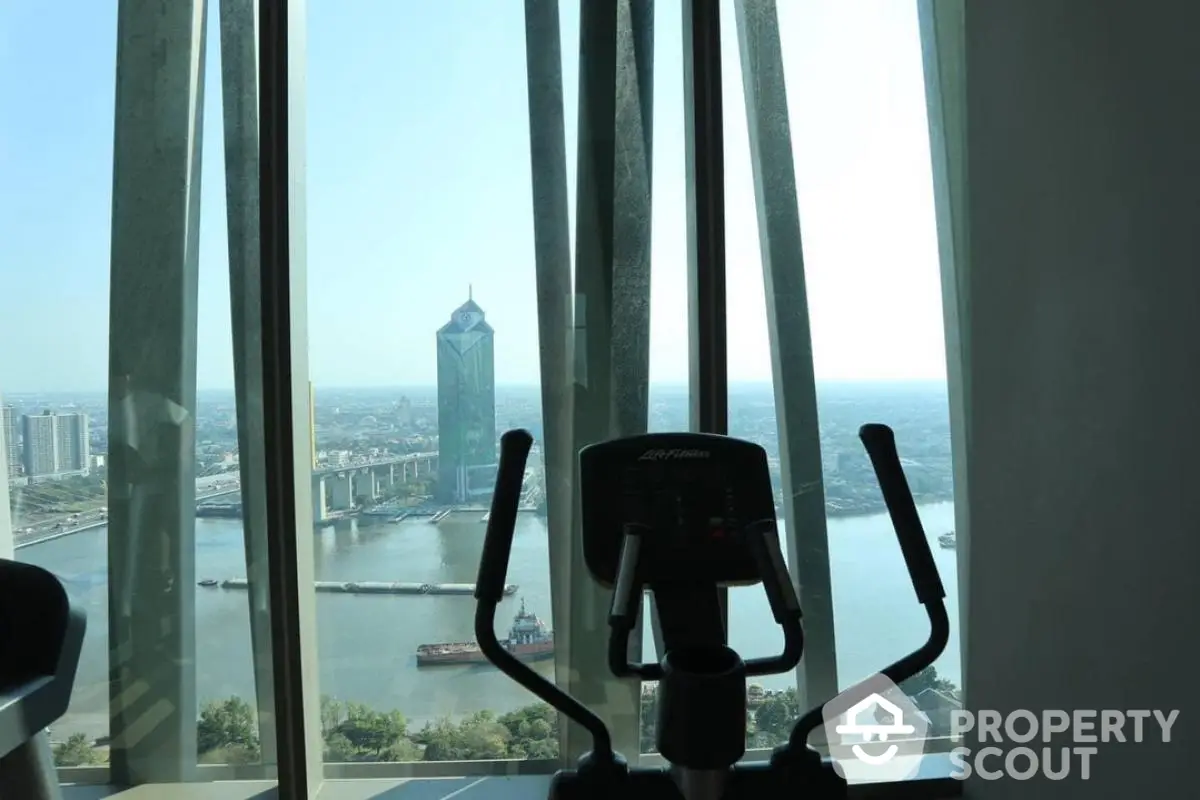 Stunning high-rise gym with panoramic city and river view