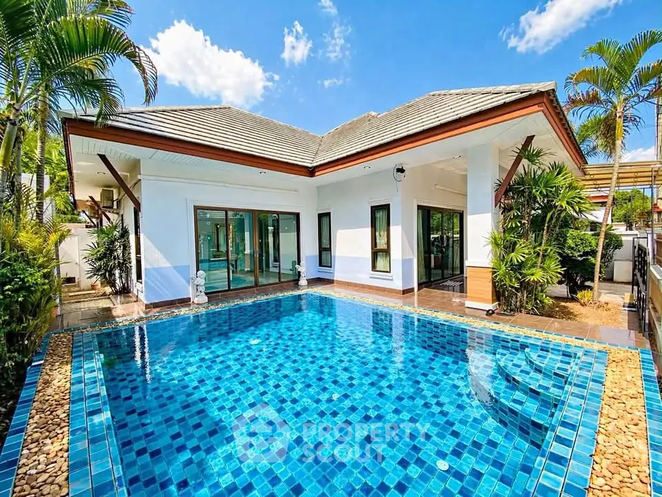 Stunning villa with private pool and lush garden, perfect for luxury living in tropical paradise.