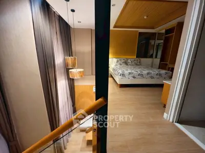 Luxurious bedroom with modern design and elegant lighting, featuring a cozy bed and stylish decor.
