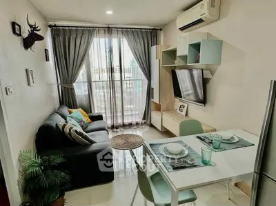 Modern living room with stylish decor and dining area in cozy apartment.