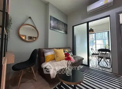 Modern living room with stylish decor and balcony view