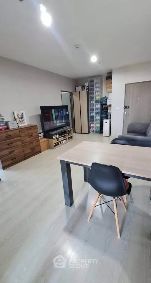 Modern living room with sleek furniture and ample storage space