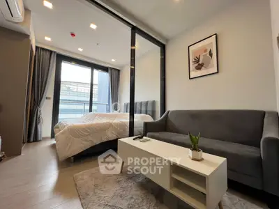 Modern studio apartment with cozy living area and stylish decor