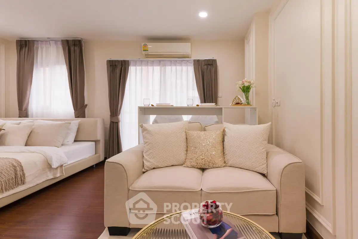 Elegant studio apartment with cozy living area and stylish decor