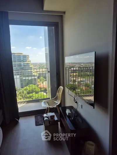 Modern apartment with stunning city view from the living room balcony, featuring sleek interior design.