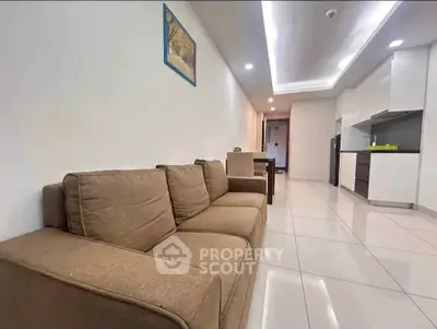 Spacious modern living room with sleek kitchen in open layout apartment