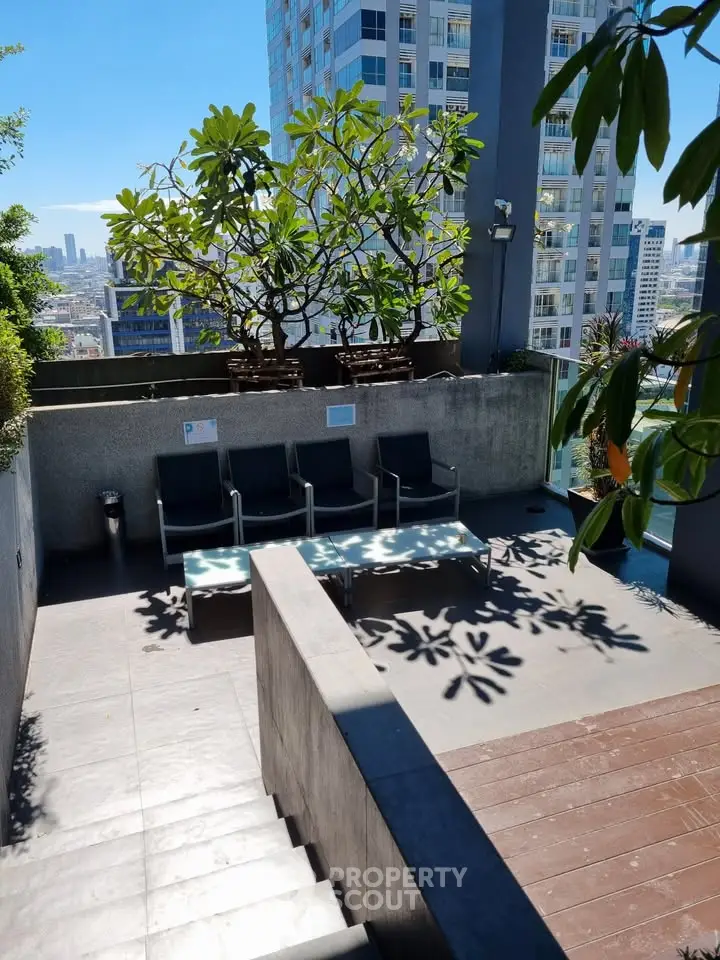 Stunning rooftop terrace with city views and lush greenery, perfect for relaxation and entertainment.