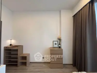 Minimalist bedroom with wooden furniture and elegant curtains