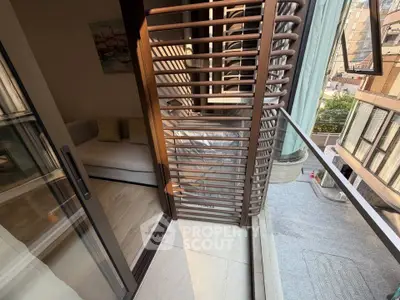 Chic urban balcony with modern railing and city view, perfect for relaxation.