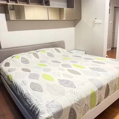 Spacious bedroom with modern decor and large bed in stylish apartment