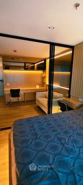 Modern bedroom with stylish study area and cozy lighting