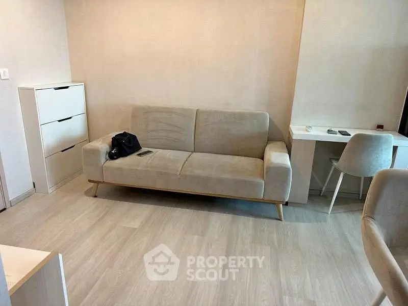 Modern living room with sleek sofa and minimalist decor, perfect for urban living.