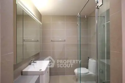 Modern bathroom with glass shower and sleek fixtures