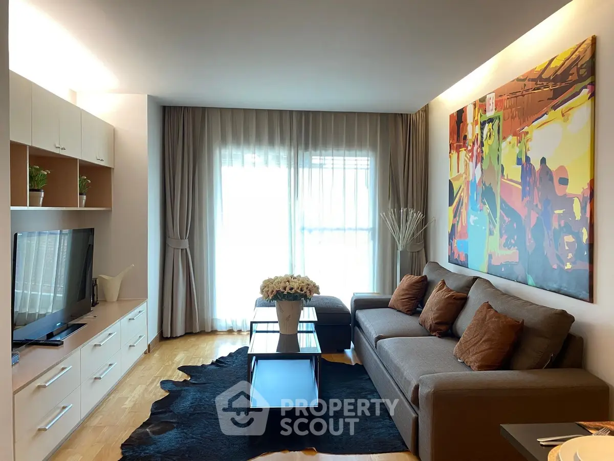 Stylish modern living room with large artwork and natural light