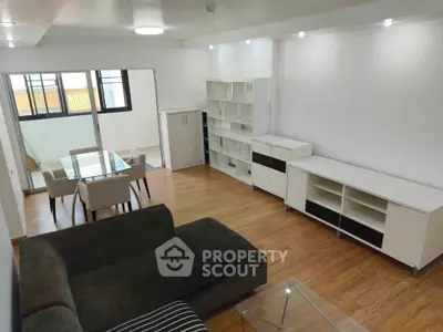 Spacious modern living room with elegant furniture and dining area