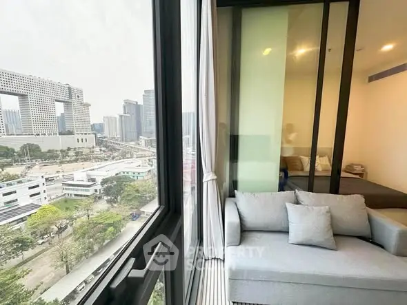 Modern apartment with stunning city view and cozy living area.