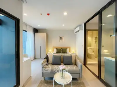 Modern studio apartment with cozy living area and stylish decor