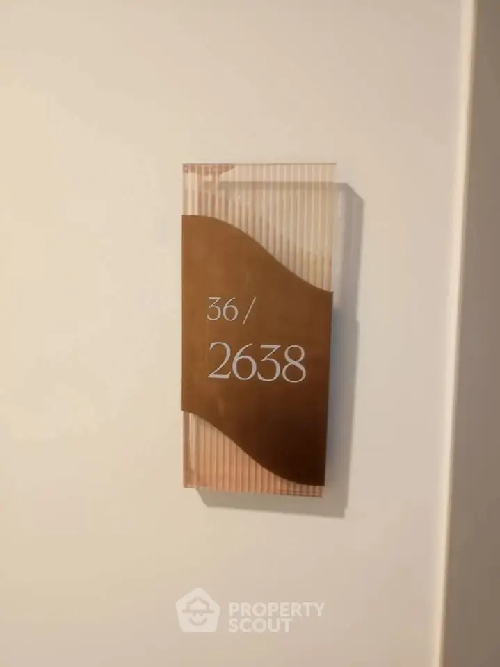 Modern apartment number sign with stylish design, perfect for contemporary living spaces.
