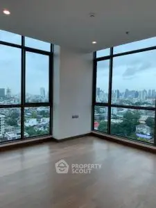Spacious corner unit with panoramic city views and large windows.