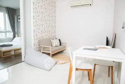 Modern apartment interior with cozy living area and stylish furniture, featuring a bright and airy ambiance.