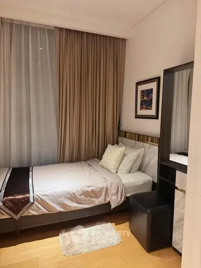 Cozy bedroom with elegant decor and soft lighting, perfect for relaxation.