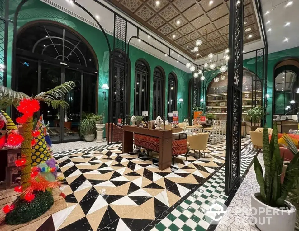 Luxurious living room with high ceilings, elegant decor, and vibrant green walls.