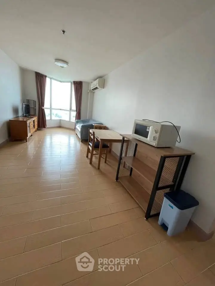 Spacious studio apartment with modern furnishings and natural light