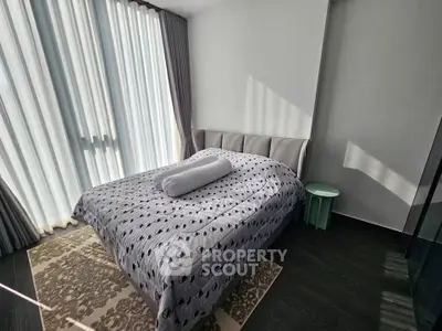 Modern bedroom with stylish decor and natural light