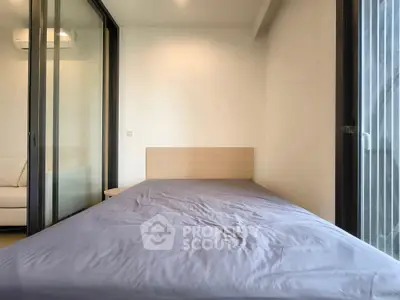 Modern bedroom with minimalist design and large windows for natural light