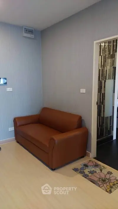 Cozy living room with brown leather sofa and modern decor