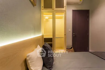 Modern bedroom with built-in closet and ambient lighting