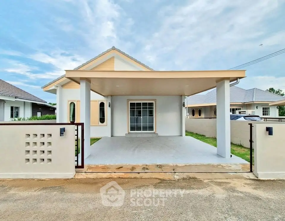 Charming single-story home with spacious driveway and modern design in a serene neighborhood.