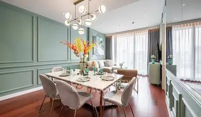 Elegant living room with modern dining area and stylish decor