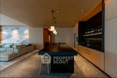 Luxurious open-plan living room with modern kitchen and stylish lighting