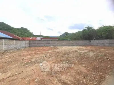 Spacious vacant lot with mountain views, ideal for development or investment opportunities.