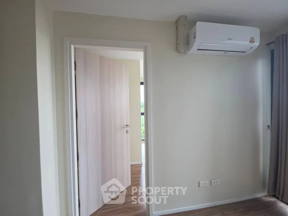 Modern interior with air conditioning and wooden flooring, perfect for comfortable living.