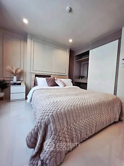 Luxurious bedroom with elegant decor and cozy bedding