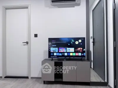 Modern living room with sleek TV setup and minimalist decor