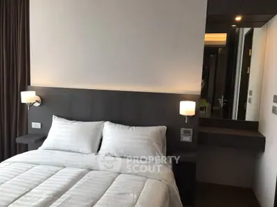 Modern bedroom with sleek design and cozy ambiance in a contemporary apartment.