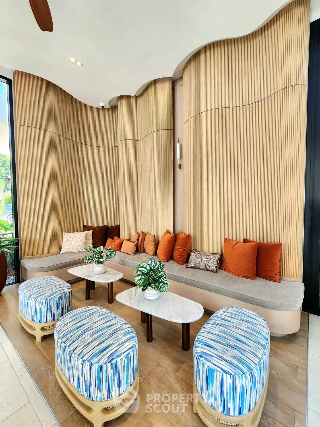 Luxurious modern living room with stylish seating and wooden panel walls