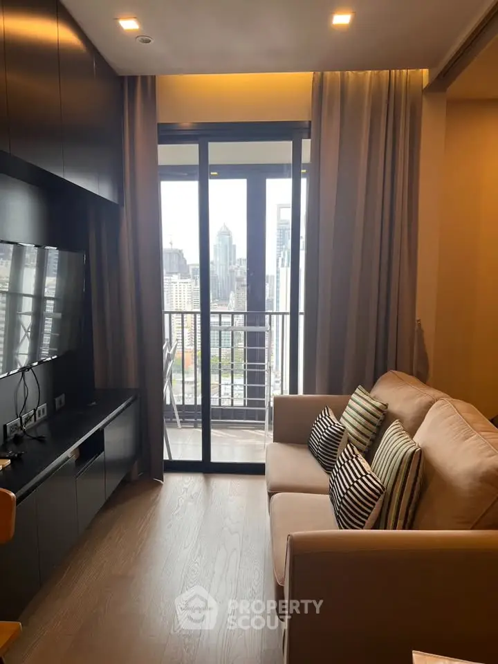 Modern living room with city view and balcony access in a stylish apartment.