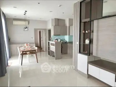 Modern open-layout kitchen and dining area with sleek design and ample natural light.