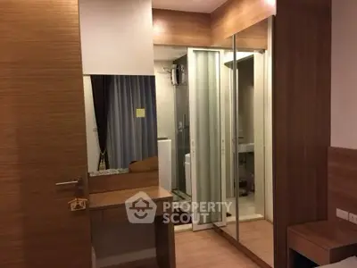 Modern bedroom with mirrored closet and wooden accents