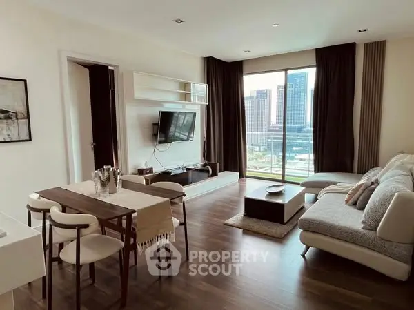 Modern living room with city view, stylish furniture, and natural light.